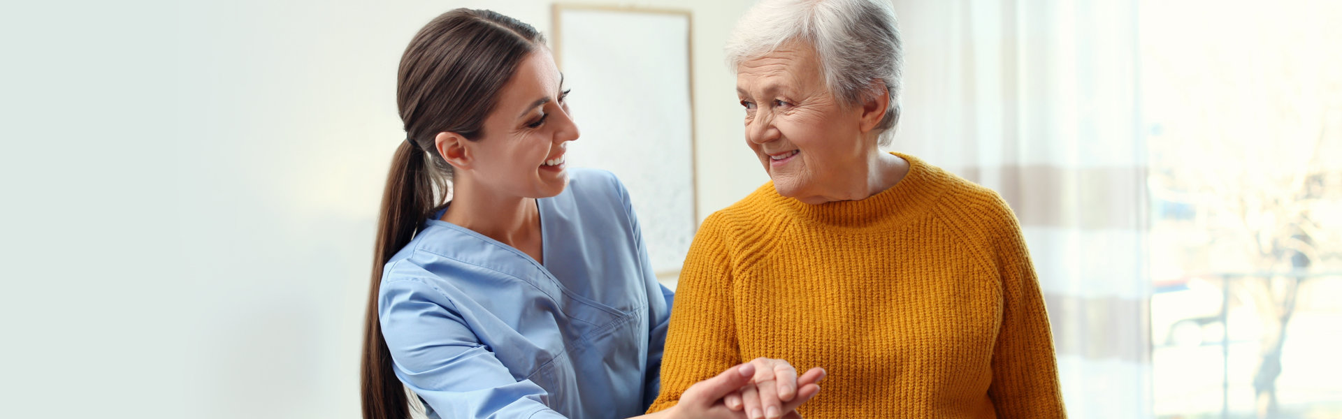 senior assisted by her aide